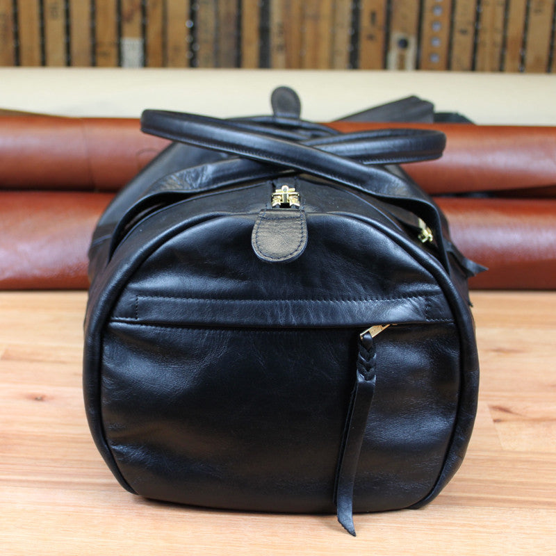 Black Leather Duffle - Swagger & Hide | Our leather luggage accessories and leather travel bags make the perfect gift for him!  All of our products are handcrafted and personalised.